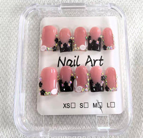 Meemooron nails with rhinestones and glossy black French tip for party styling