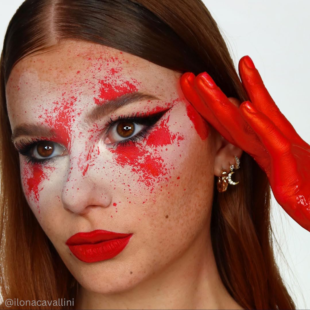 Applying Mehron Red with sponge—easy direct-to-skin layer for quick costume coverage.