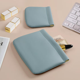 MEIBOOCH travel-friendly blue pouch shown in a daily-use setting.