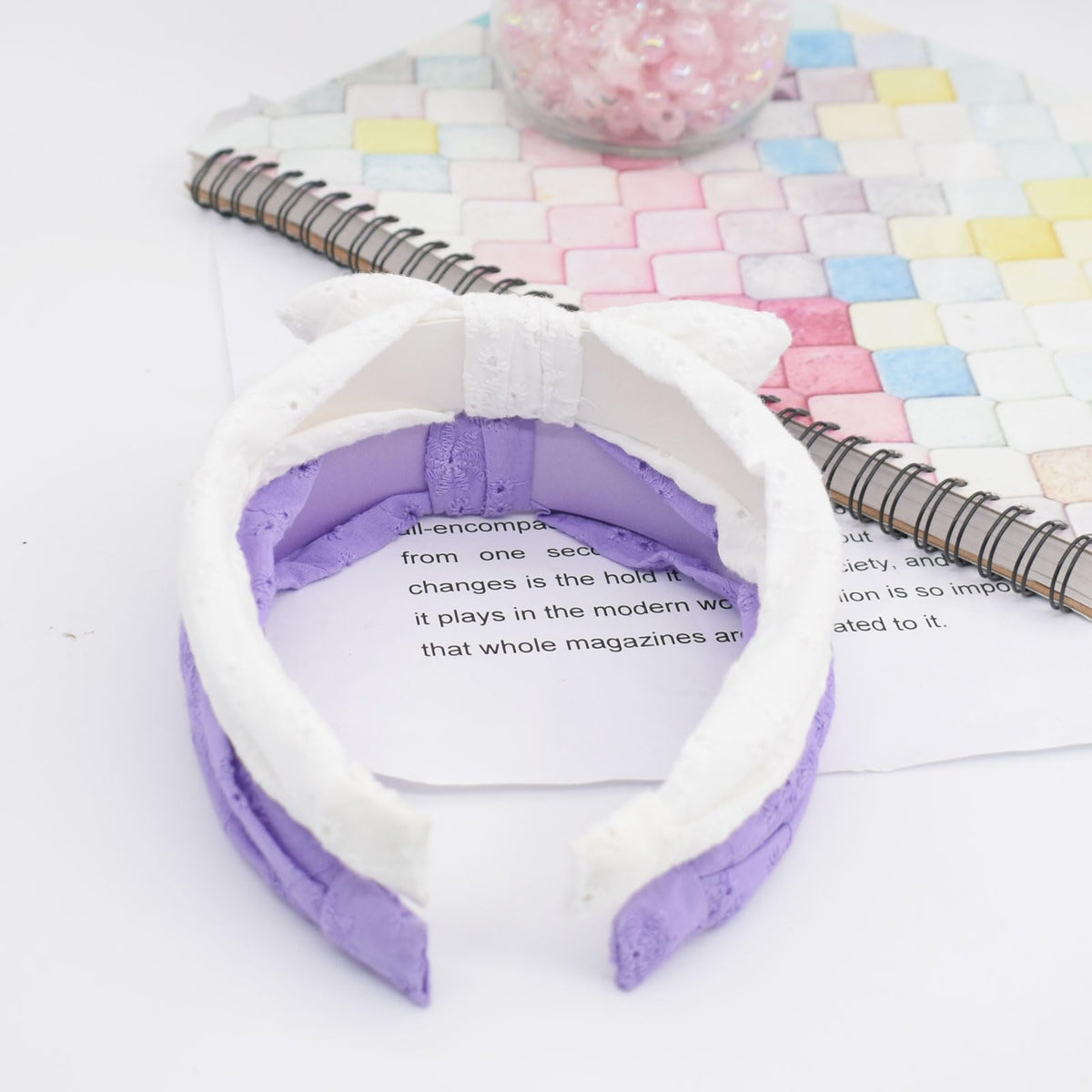 Melbelia headband features delicate flower embroidery for added charm.