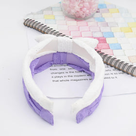 Melbelia headband features delicate flower embroidery for added charm.