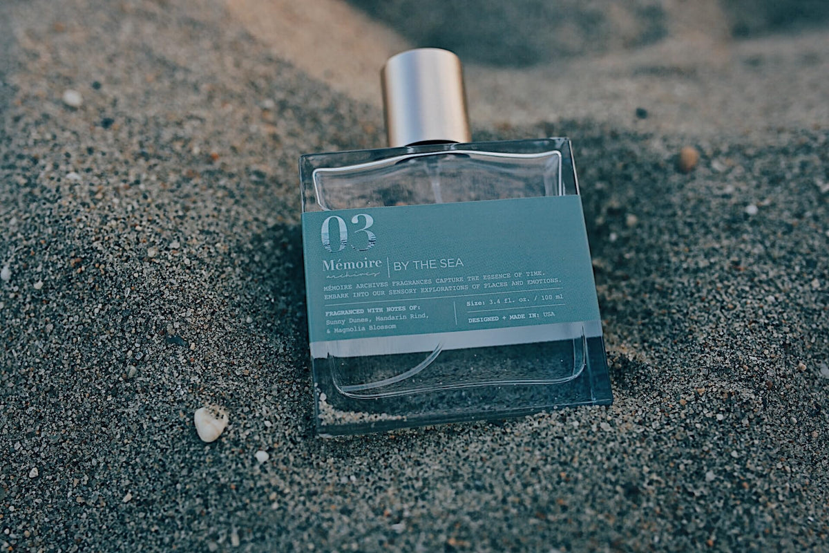 Memoire Archives By The Sea EDP bottle being poured suggests long lasting freshness for daily wear