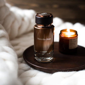 Elegant cylindrical bottle design reinforces timeless luxury and confidence.