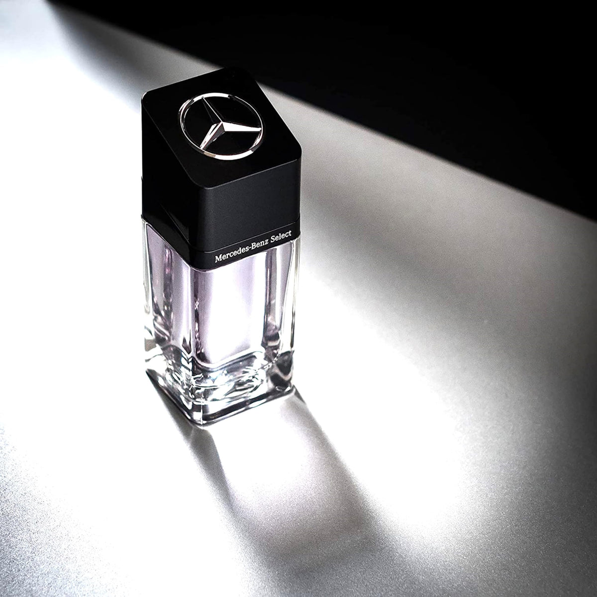 Mercedes-Benz Select woody base note representation, long-lasting warm trail.