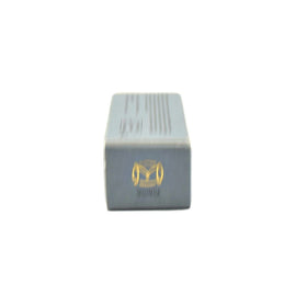Merit Bronze Balm Quince arm swatch illustrates buildable intensity.