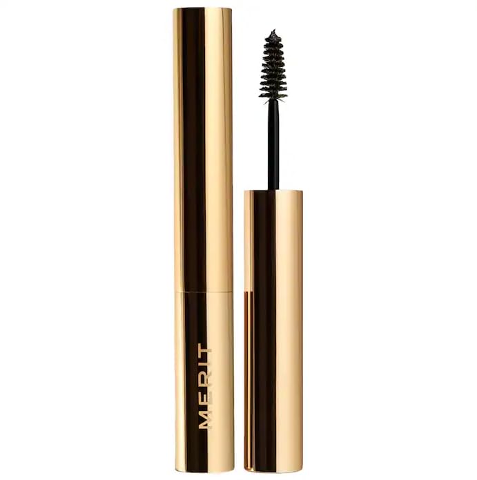 Merit Brow 1980 volumizing pomade in a compact jar for defined, natural-looking brows all day.