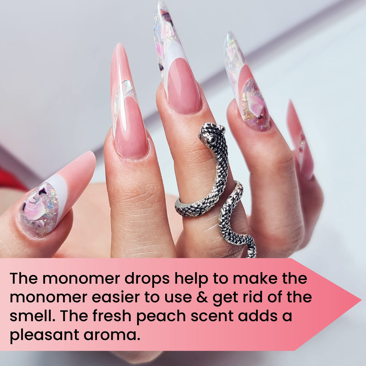 Mia Secret Monomer Drops Peach bottle on a busy salon desk