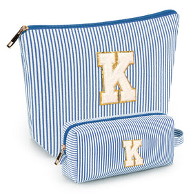 Mibasies initial makeup bags blue front view, compact travel-ready design for cosmetics.