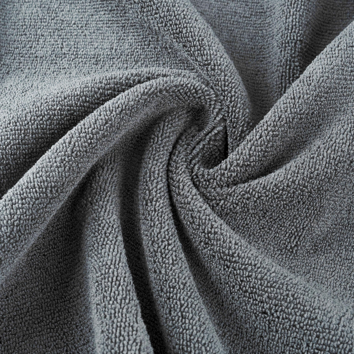 MICROFI four-pack gray towels drying hair efficiently after washing.