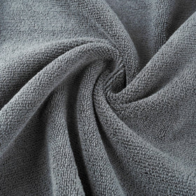MICROFI four-pack gray towels drying hair efficiently after washing.