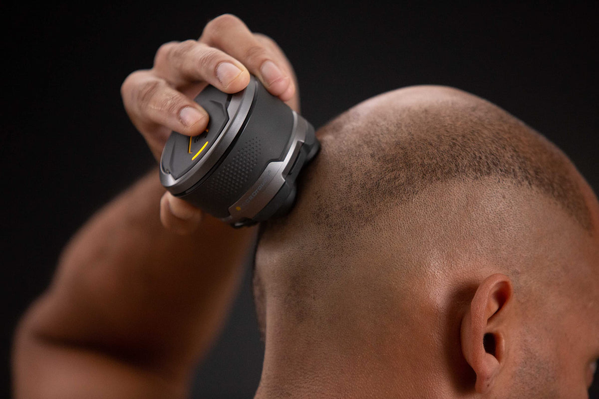 MicroTouch Titanium Head Shaver with hair capture chamber for easy cleanup.