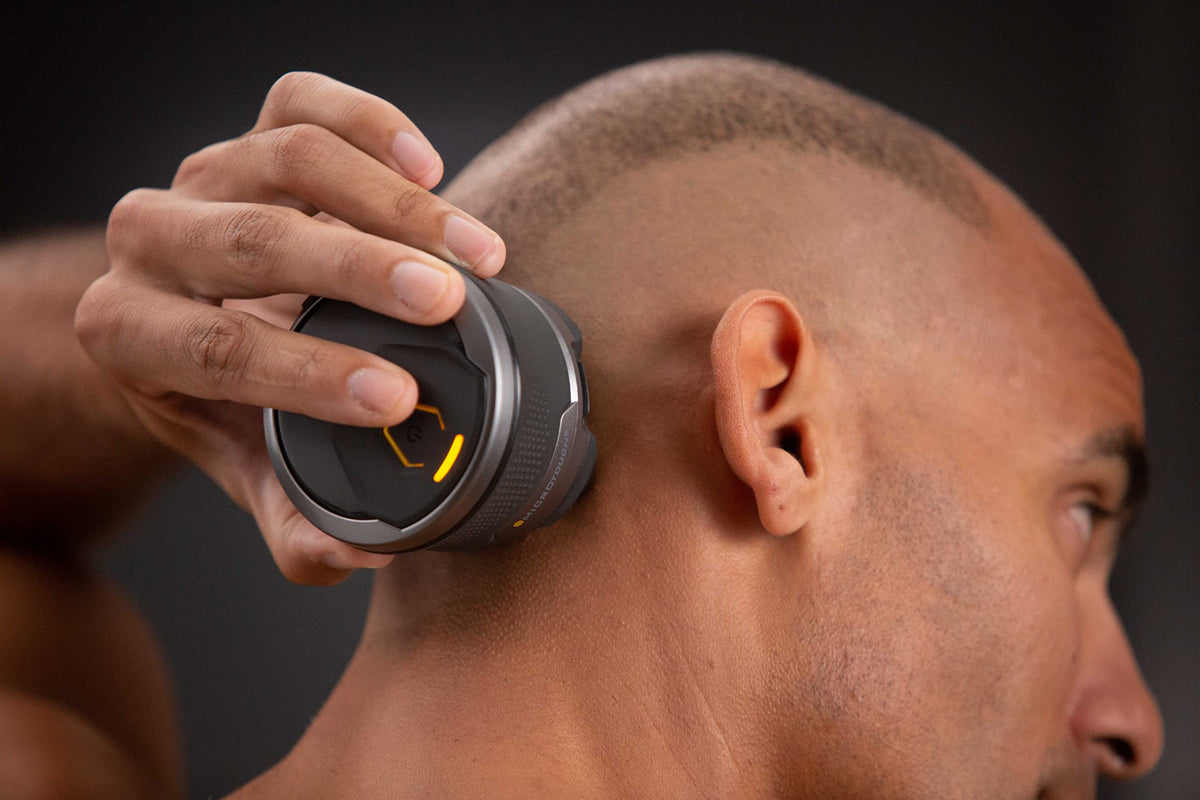 MicroTouch Titanium Head Shaver in wet/dry setup for versatile use.