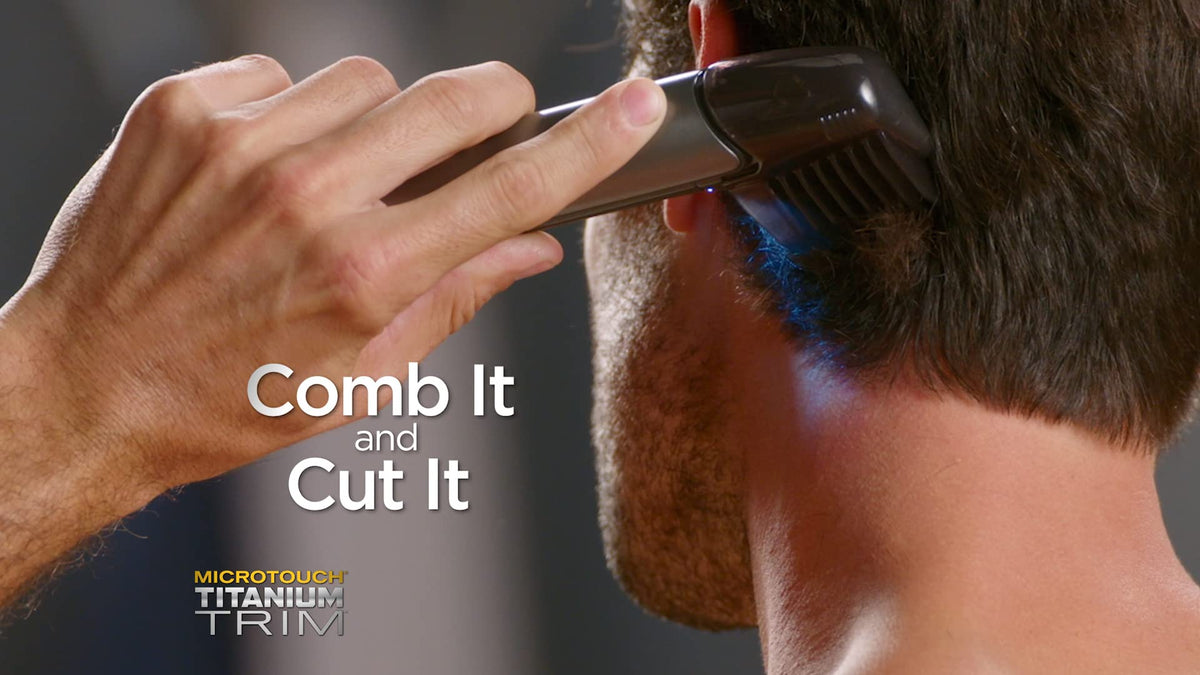 MicroTouch TRIM PRO extend-arm demonstrates reach for back and shoulders grooming.