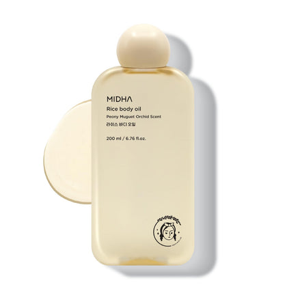 Midha Rice Body Oil bottle close-up, lightweight hydration for radiant skin.
