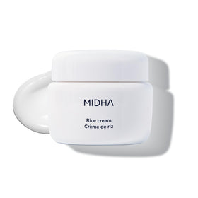 MIDHA Rice Cream bottle closeup showcasing a dewy finish for daily hydration.
