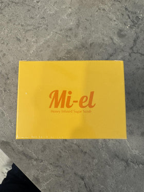 Mi-el Honey Infused Sugar Scrub in the shower delivering hydrating exfoliation.