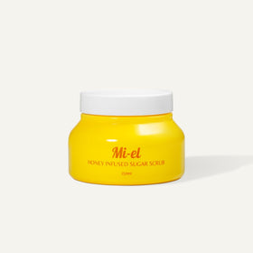 Mi-el Honey Infused Sugar Scrub jar on shelf showing creamy exfoliation.