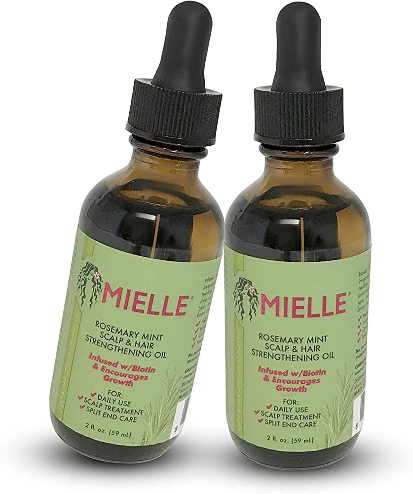 Mielle Organics Rosemary Mint Hair Growth Oil bottle pour promotes scalp nourishment.