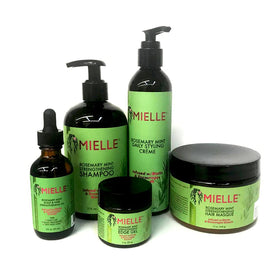 Mielle Rosemary Mint Strengthening Shampoo bottle cleanses and nourishes dry hair.