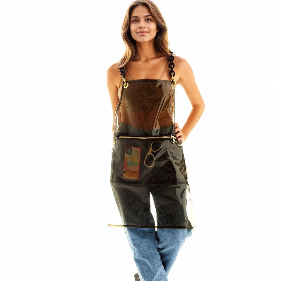 MIKI WELL clear apron with large pocket for tool storage.
