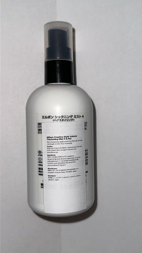 Closeup of Milbon Creative Style Volume Thickening Mist bottle, showcasing easy styling and controlled volume.