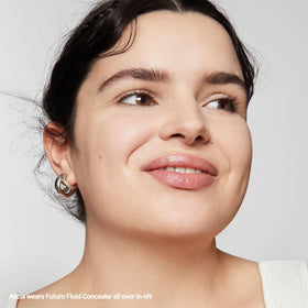 Milk Makeup Future Fluid Concealer swirl texture demonstrates creamy consistency on skin.