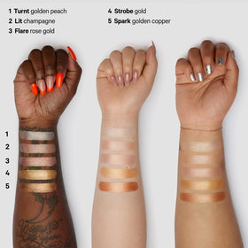 Milk Makeup Highlighter on shoulders brings soft, healthy sheen.