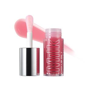 Milk Makeup KUSH lip oil in Dream Machine Mauve applying for sheer color and hydration.