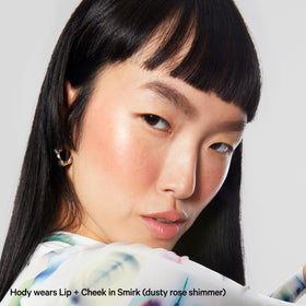 Milk Makeup Lip + Cheek Stick shown on lips with soft shimmer.