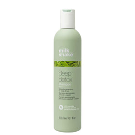 Milk Shake Deep Detox Shampoo bottle close-up highlights green tea extract for nourishing scalp-to-ends.