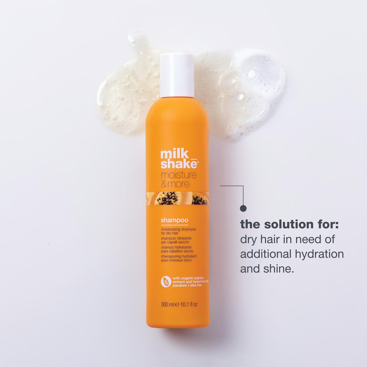 Milk Shake Moisture & More Shampoo being poured, forming creamy lather for hydration.