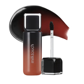 MILKTOUCH Black Peel Off Lip Tattoo swatch reveals bold Black Fig color with long-lasting matte finish