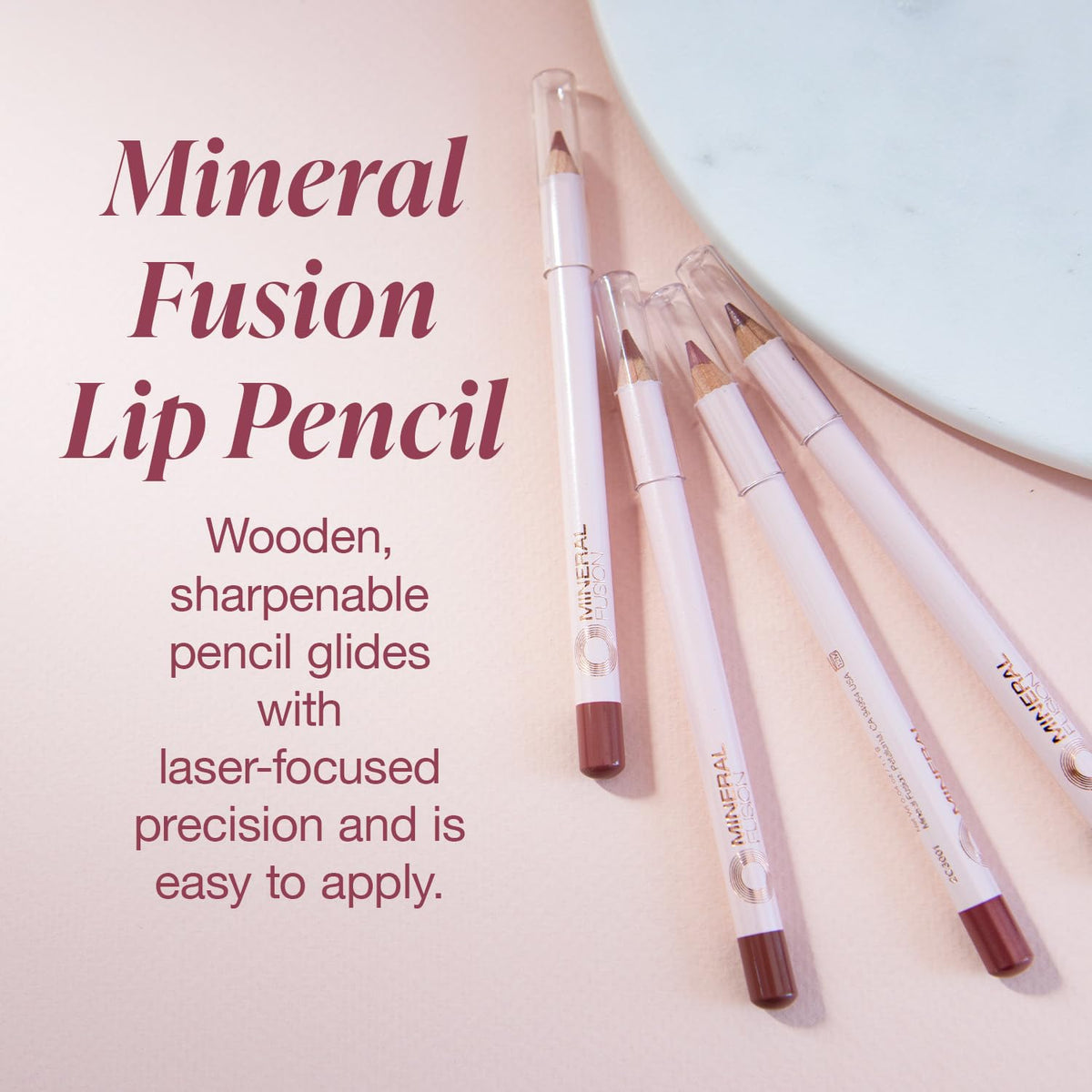 Mineral Fusion Lip Liner Burnish pencil demonstrates precise lip shaping.