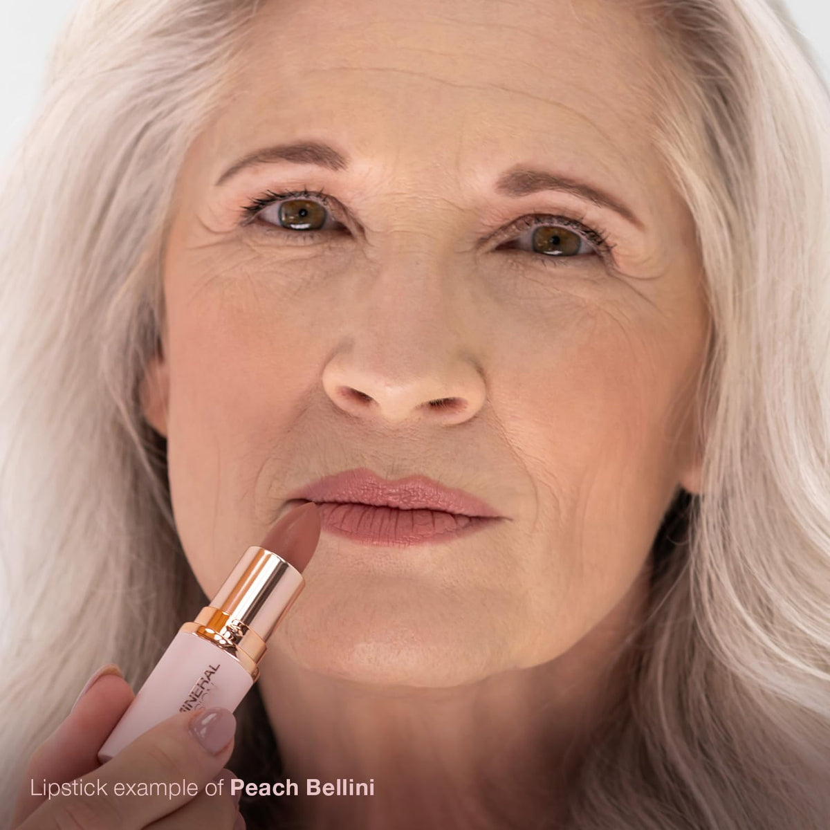 Mineral Fusion Peach Bellini applies on lips with smooth glide and buildable coverage.