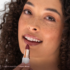 Mineral Fusion Plum Wine swatch on skin shows rich pigment and hydration.