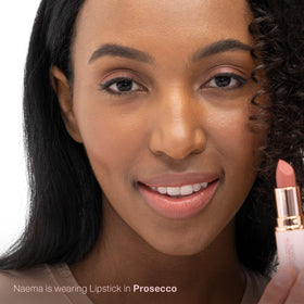 Mineral Fusion Prosecco lipstick application glide highlighting buttery-smooth texture.