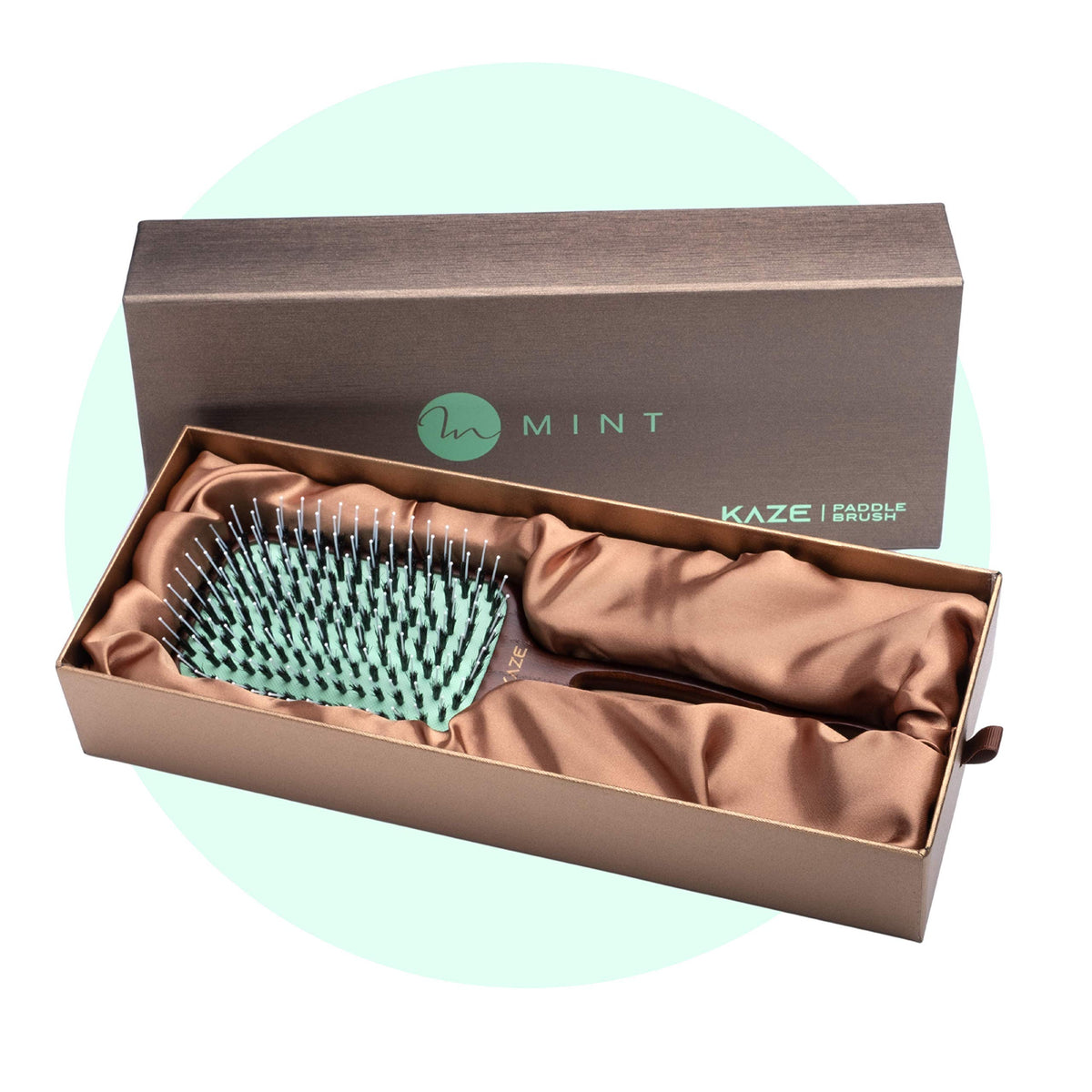 MINT durable paddle brush in use emphasizing long-lasting design.