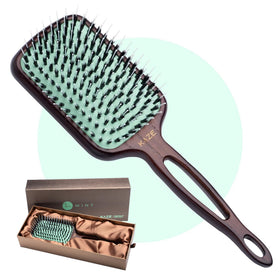 MINT eco-friendly boar bristle paddle brush distributes natural scalp oils.