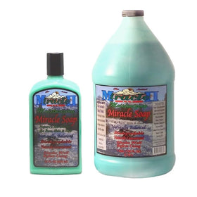 Miracle II Moisturizing Soap gallon bottle on bathroom shelf, easy cleanser for skin and hair.