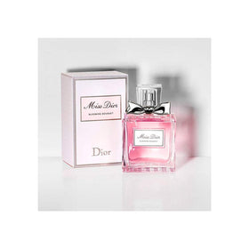 Miss Dior Blooming Bouquet EDT cap closeup highlighting delicate floral cap and branding.