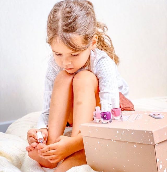 MISS NELLA child applying polish for safe playtime beauty.