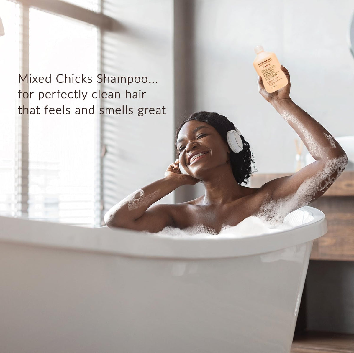 Mixed Chicks Gentle Clarifying Shampoo bottle beside smoother hair texture