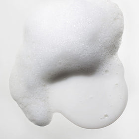 Wet hair being massaged with Mizani Moisture Fusion Shampoo showing cleansing and moisture