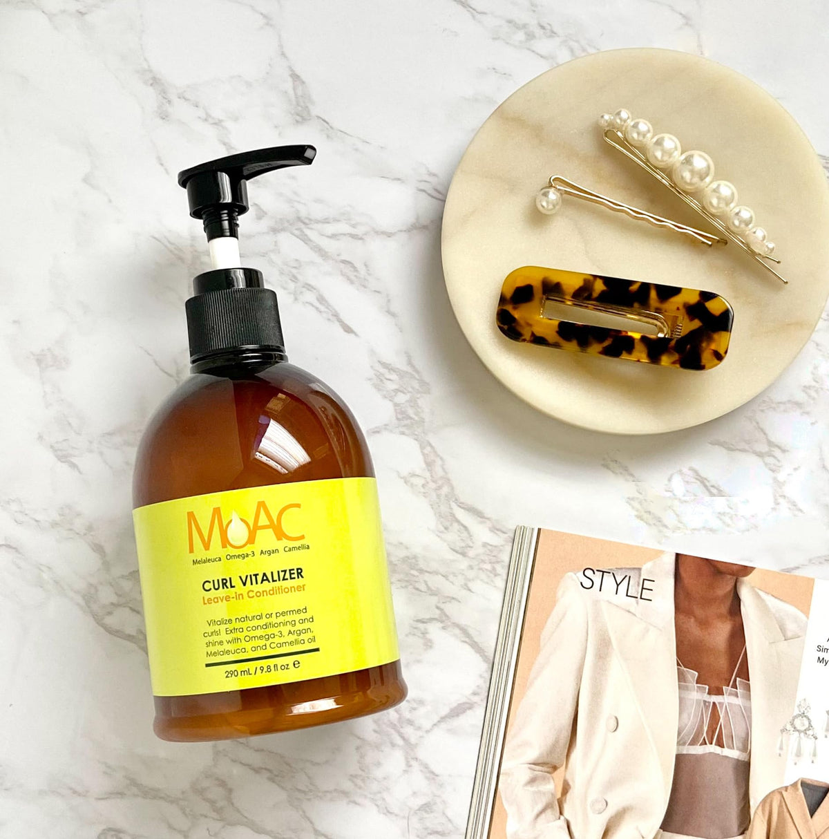 Moac Curl Vitalizer product shot emphasizing non-greasy formula.