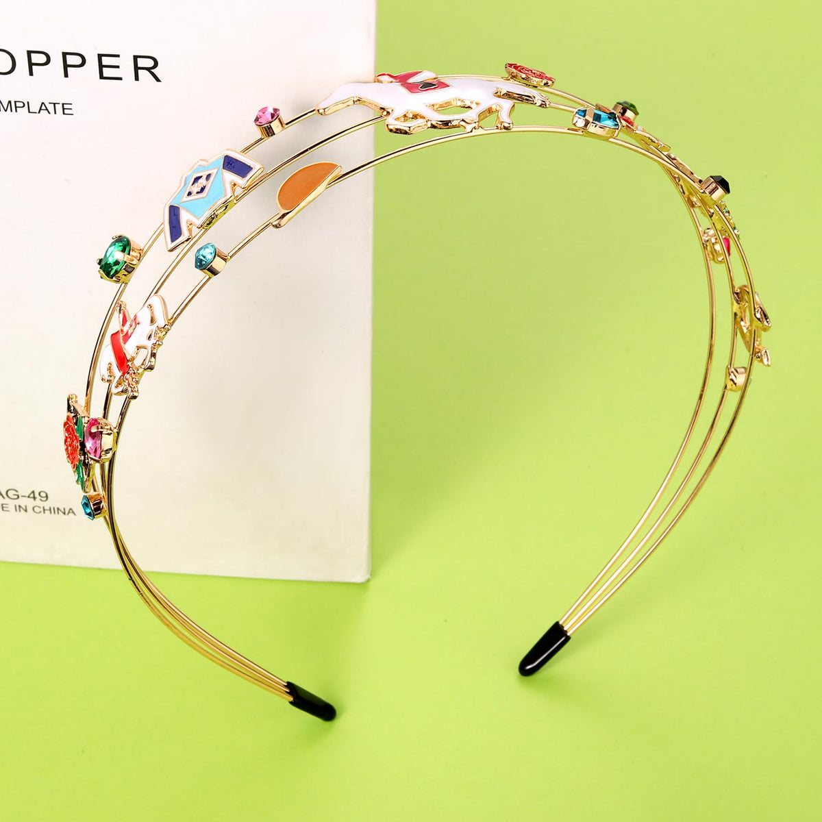 Mokkia derby headband with enamel horse detail for chic look.