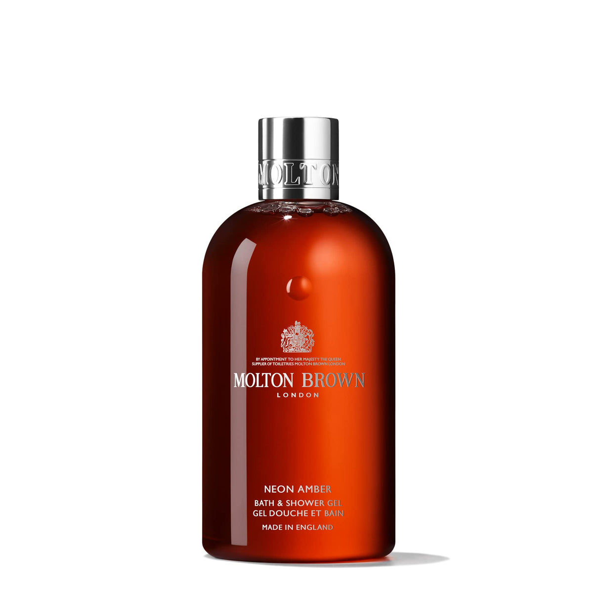 Molton Brown Neon Amber bottle pour; enhances daily cleanse with warm, sensuous notes.