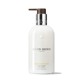 Molton Brown Orange & Bergamot Body Lotion bottle showcases bright citrus fragrance.