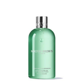 Molton Brown Wild Mint & Lavandin bottle foreground for invigorating mornings