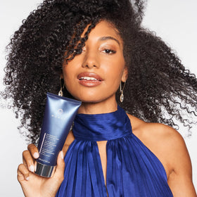 MONAT Curl Perfection Cream swirl texture illustrating versatile moisturization for waves and curls.
