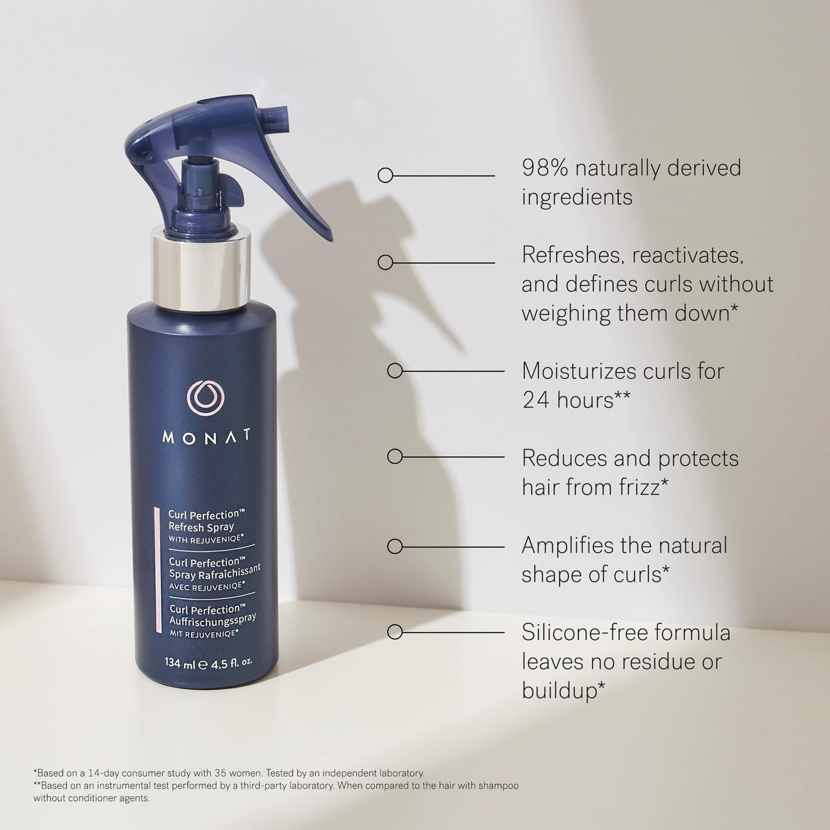 MONAT Curl Perfection Refresh Spray on curly hair defines texture.